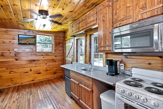 2967 Roby Martin Rd, Lenoir, NC 28645 - kitchen featuring white electric range, stainless steel microwave, a sink, wooden walls, and wood ceiling