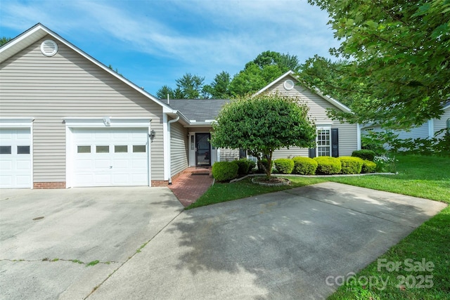 16 Red Barn Ln, Fletcher, NC 28732 - ranch-style home with driveway, an attached garage, and a front lawn