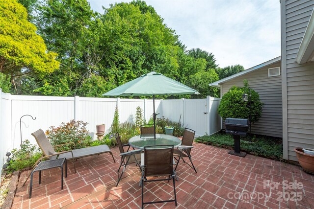16 Red Barn Ln, Fletcher, NC 28732 - fenced backyard with a patio and outdoor dining space