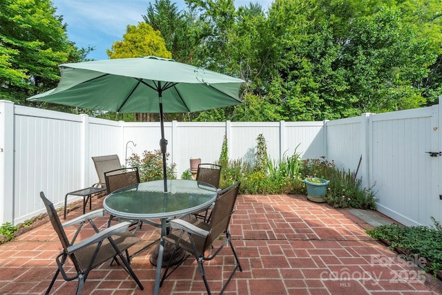 16 Red Barn Ln, Fletcher, NC 28732 - fenced backyard featuring a patio and outdoor dining area