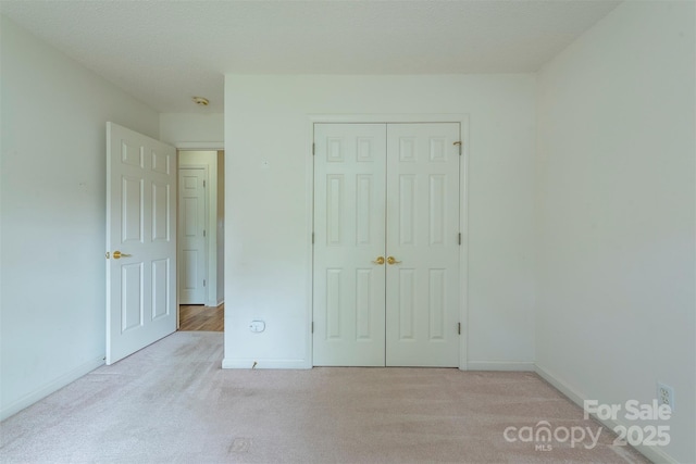 16 Red Barn Ln, Fletcher, NC 28732 - unfurnished bedroom featuring carpet flooring and a closet