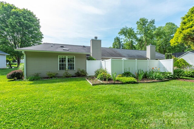 16 Red Barn Ln, Fletcher, NC 28732 - back of property with a chimney