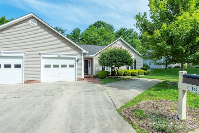 16 Red Barn Ln, Fletcher, NC 28732 - ranch-style house featuring concrete driveway, a front lawn, and a garage