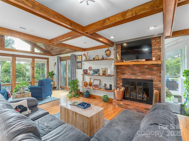 95 Harmon Ave, Lake Junaluska, NC 28745 - living area with plenty of natural light, wood finished floors, and a fireplace