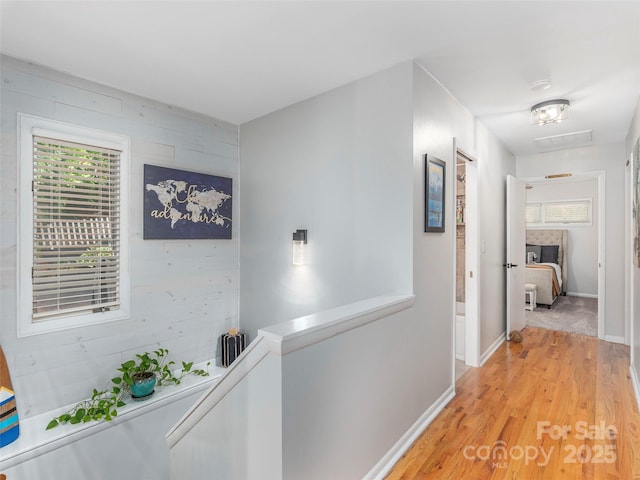 95 Harmon Ave, Lake Junaluska, NC 28745 - corridor with light wood finished floors, baseboards, and an upstairs landing