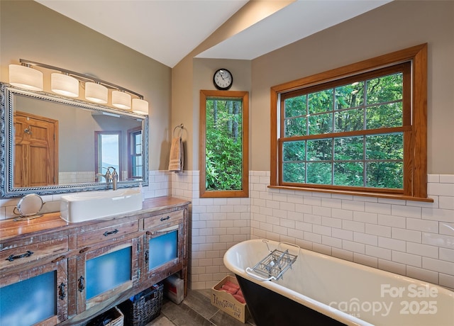 724 Pless Underwood Rd, Maggie Valley, NC 28751 - bathroom with tile walls, a soaking tub, vanity, and a wainscoted wall
