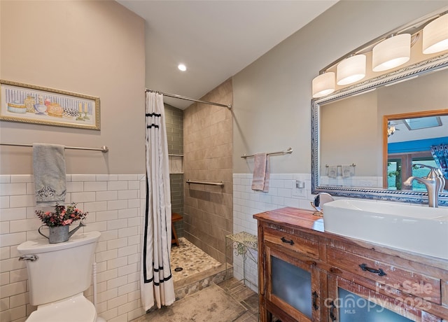 724 Pless Underwood Rd, Maggie Valley, NC 28751 - bathroom with tile walls, a tile shower, vanity, wainscoting, and tile patterned flooring