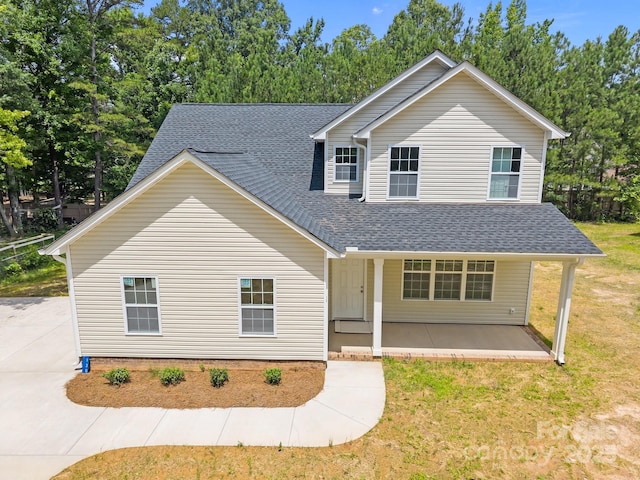130 Aurora Blvd, Matthews, NC 28105 - traditional-style house featuring a shingled roof and a front yard