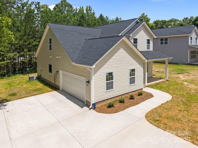 130 Aurora Blvd, Matthews, NC 28105 - view of side of property with roof with shingles, concrete driveway, a lawn, and a porch