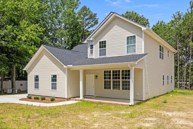 130 Aurora Blvd, Matthews, NC 28105 - view of front of property with roof with shingles and a front lawn