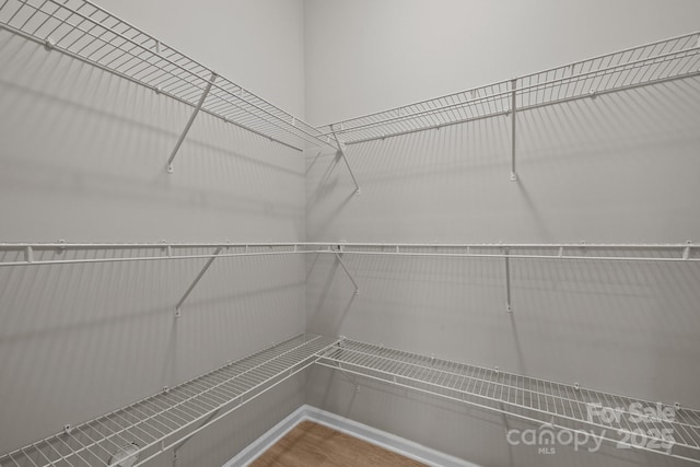 130 Aurora Blvd, Matthews, NC 28105 - walk in closet featuring wood finished floors