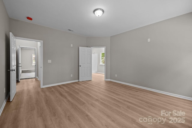 130 Aurora Blvd, Matthews, NC 28105 - unfurnished bedroom with light wood-type flooring and baseboards