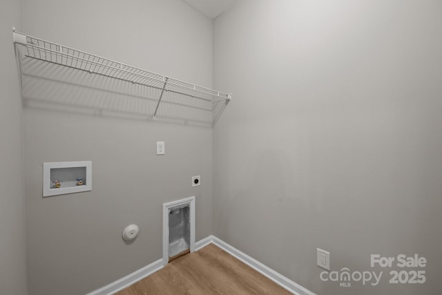 130 Aurora Blvd, Matthews, NC 28105 - washroom featuring washer hookup, hookup for a gas dryer, hookup for an electric dryer, and light wood-style flooring