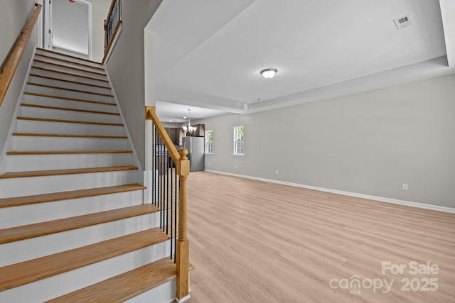 130 Aurora Blvd, Matthews, NC 28105 - stairs featuring wood finished floors and a chandelier