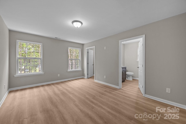 130 Aurora Blvd, Matthews, NC 28105 - unfurnished bedroom with light wood-type flooring and ensuite bathroom