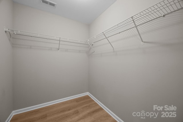 130 Aurora Blvd, Matthews, NC 28105 - spacious closet featuring wood finished floors