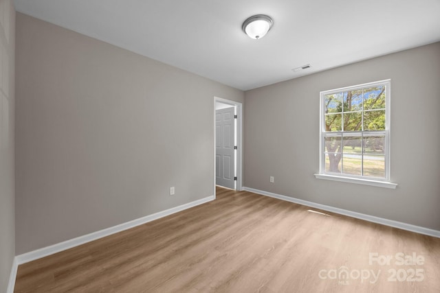 130 Aurora Blvd, Matthews, NC 28105 - spare room with wood finished floors and baseboards