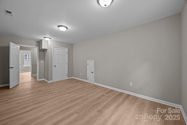 130 Aurora Blvd, Matthews, NC 28105 - empty room with light wood-type flooring and baseboards
