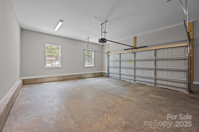 130 Aurora Blvd, Matthews, NC 28105 - garage featuring a garage door opener and baseboards