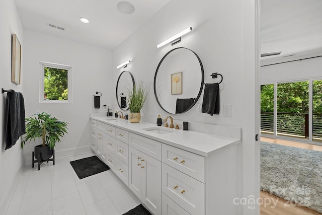 2121 Laburnum Ave, Charlotte, NC 28205 - bathroom with double vanity and tile patterned flooring