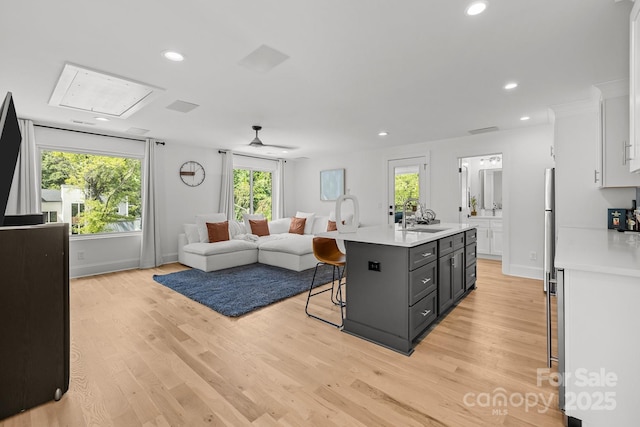 2121 Laburnum Ave, Charlotte, NC 28205 - living room with attic access, light wood-style flooring, and recessed lighting