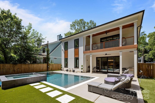 2121 Laburnum Ave, Charlotte, NC 28205 - back of property with a balcony, a ceiling fan, a fenced backyard, a patio, and an outdoor living space