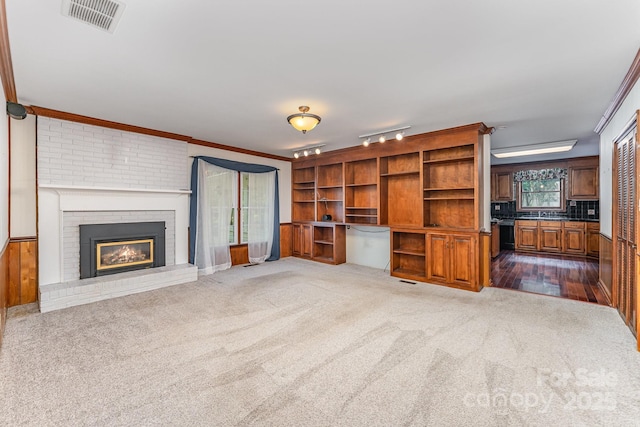 220 Blackberry Trl, Concord, NC 28027 - unfurnished living room with dark carpet, a fireplace, and ornamental molding