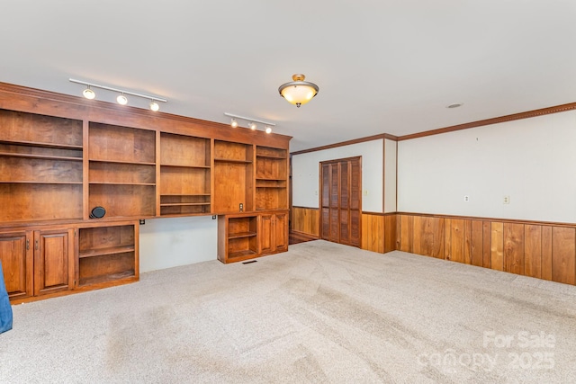 220 Blackberry Trl, Concord, NC 28027 - unfurnished living room with wainscoting, carpet, and wooden walls