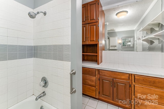220 Blackberry Trl, Concord, NC 28027 - bathroom with a textured ceiling, shower / bath combination, ornamental molding, vanity, and tile patterned flooring