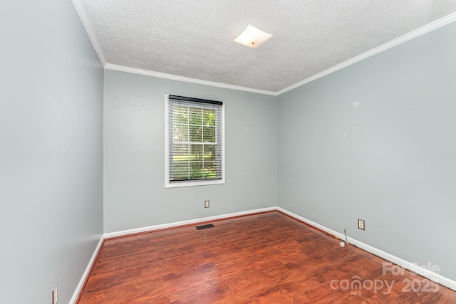 220 Blackberry Trl, Concord, NC 28027 - empty room featuring baseboards, wood finished floors, a textured ceiling, and crown molding