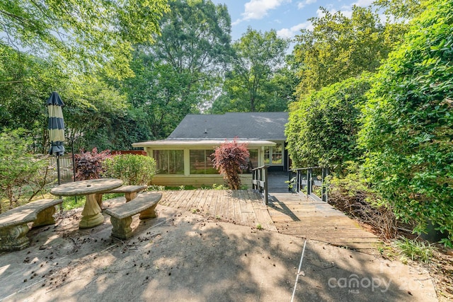 220 Blackberry Trl, Concord, NC 28027 - rear view of property with a sunroom and roof with shingles