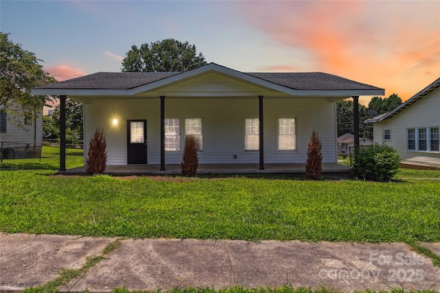 113 Woodside Ave, Gastonia, NC 28054 - view of front of house featuring covered porch, a front lawn, and a shingled roof