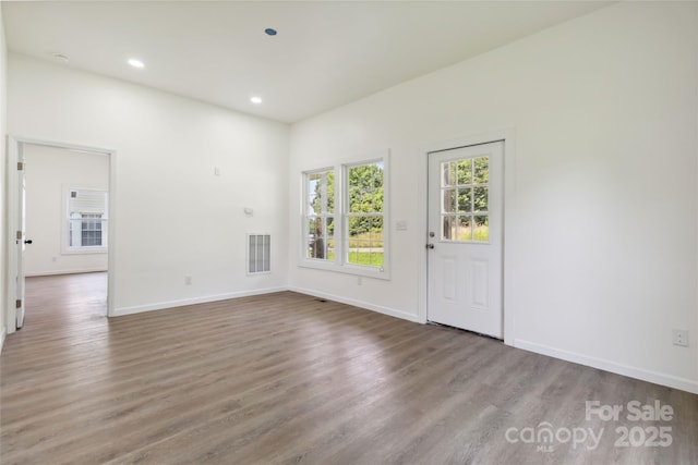 113 Woodside Ave, Gastonia, NC 28054 - spare room featuring wood finished floors and recessed lighting