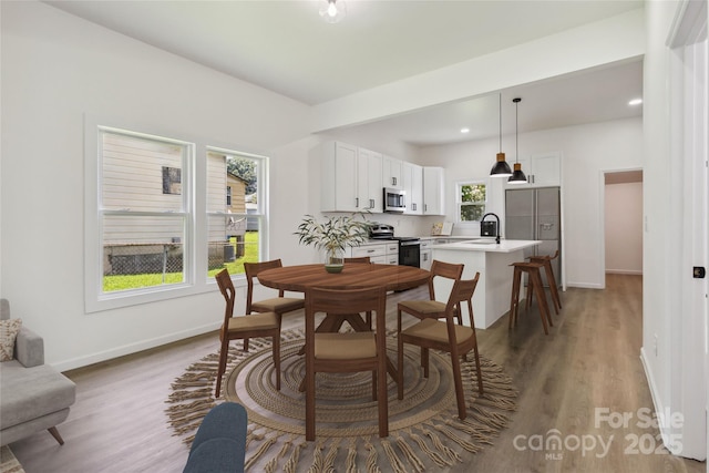 113 Woodside Ave, Gastonia, NC 28054 - dining space with light wood-style floors and recessed lighting