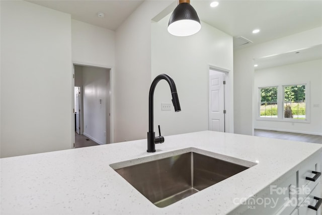 113 Woodside Ave, Gastonia, NC 28054 - kitchen featuring light stone counters, recessed lighting, and hanging light fixtures