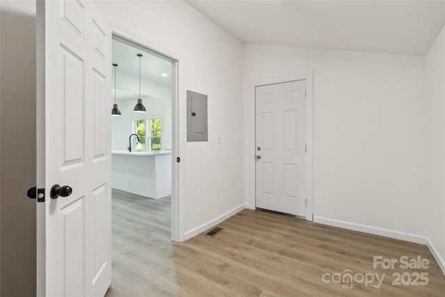 113 Woodside Ave, Gastonia, NC 28054 - foyer featuring electric panel, light wood finished floors, and vaulted ceiling