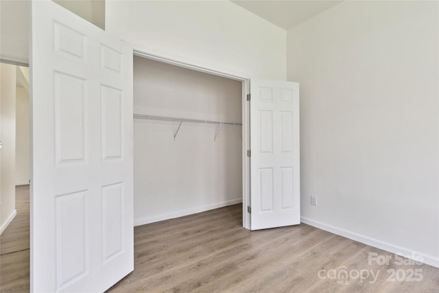 113 Woodside Ave, Gastonia, NC 28054 - unfurnished bedroom featuring light wood finished floors and a closet