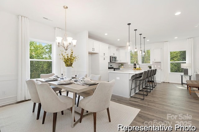 24578 Blue Heron Cir Unit 407, Lancaster, SC 29720 - dining space with light wood-type flooring, recessed lighting, a chandelier, and baseboards