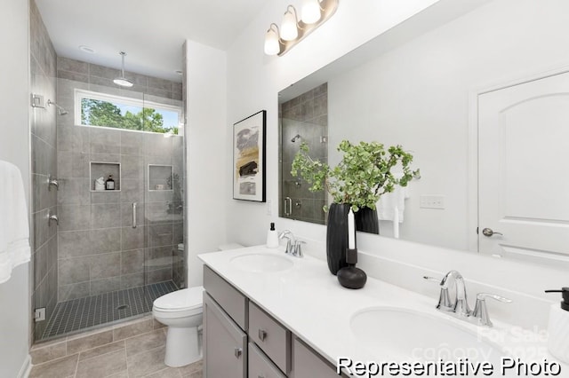 24578 Blue Heron Cir Unit 407, Lancaster, SC 29720 - full bathroom featuring double vanity, a stall shower, and toilet