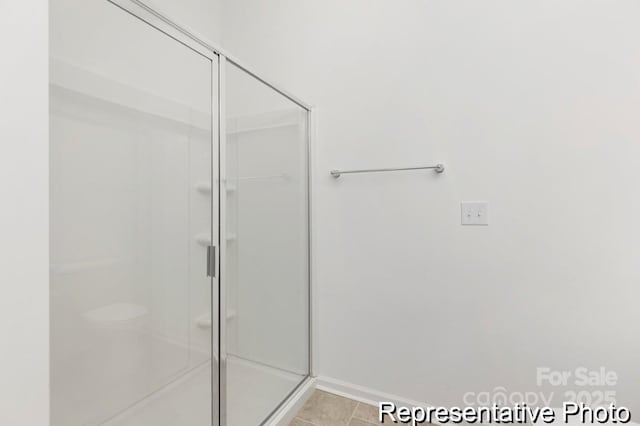 24578 Blue Heron Cir Unit 407, Lancaster, SC 29720 - full bath with a shower stall, baseboards, and tile patterned floors