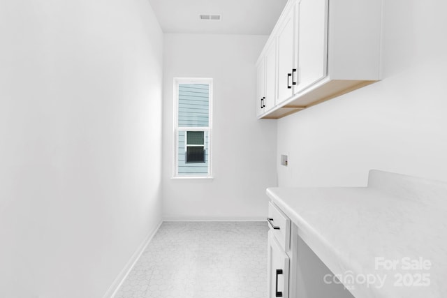 24578 Blue Heron Cir Unit 407, Lancaster, SC 29720 - laundry room featuring cabinet space, washer hookup, and tile patterned floors