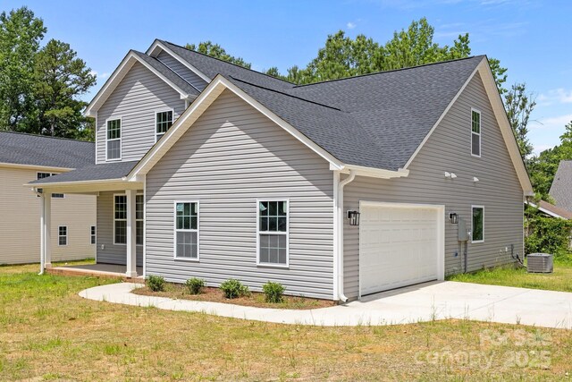 126 Aurora Blvd, Matthews, NC 28105 - view of front of home featuring concrete driveway, an attached garage, roof with shingles, and a front lawn