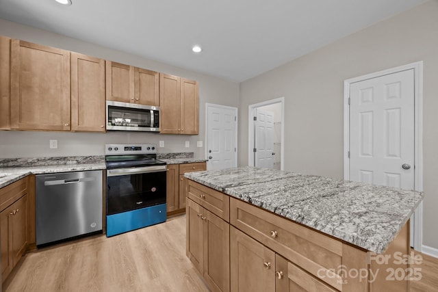 126 Aurora Blvd, Matthews, NC 28105 - kitchen featuring appliances with stainless steel finishes, light wood-style floors, light stone counters, light brown cabinets, and recessed lighting