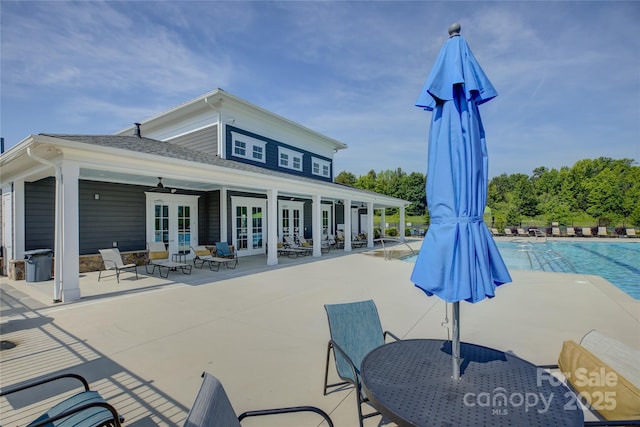 9226 Dunwich Dr, Gastonia, NC 28056 - community pool featuring french doors, a patio area, and outdoor dining space