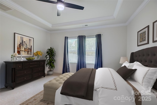 9226 Dunwich Dr, Gastonia, NC 28056 - bedroom with a raised ceiling, ornamental molding, light carpet, and a ceiling fan
