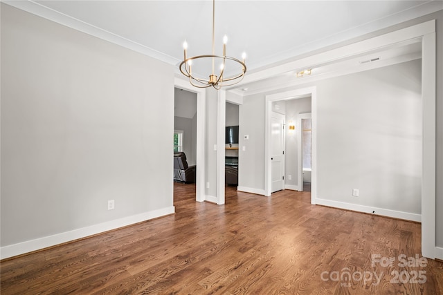 1004 E Sandy Ridge Rd, Monroe, NC 28112 - empty room with a chandelier, wood finished floors, and crown molding