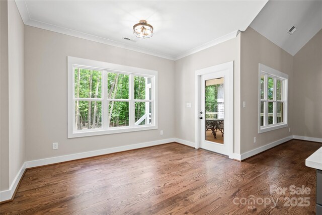 1004 E Sandy Ridge Rd, Monroe, NC 28112 - spare room with healthy amount of natural light, dark wood-type flooring, and ornamental molding