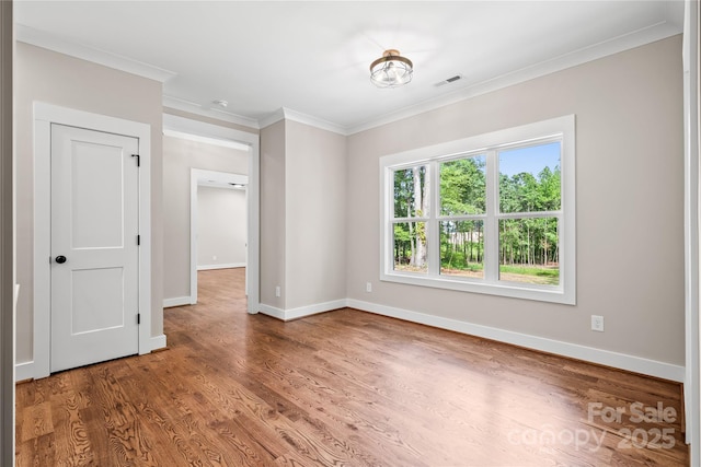 1004 E Sandy Ridge Rd, Monroe, NC 28112 - unfurnished room featuring wood finished floors and crown molding