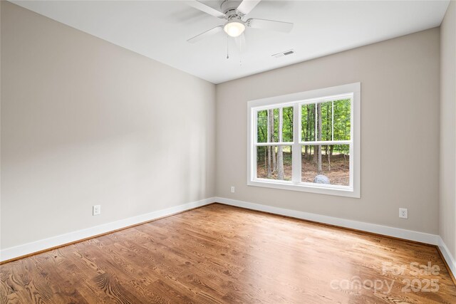 1004 E Sandy Ridge Rd, Monroe, NC 28112 - empty room featuring wood finished floors and a ceiling fan