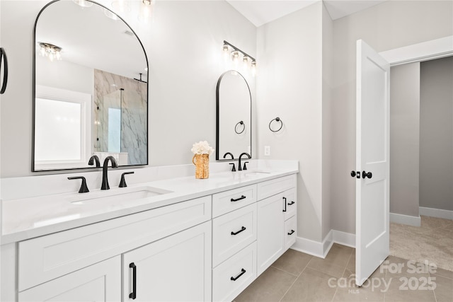 1004 E Sandy Ridge Rd, Monroe, NC 28112 - full bath featuring a marble finish shower, double vanity, and tile patterned flooring